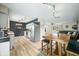 Bright kitchen featuring stainless steel appliances, white cabinets and a wooden table with stools at 2072 S Rembrandt Cv, Martinsville, IN 46151