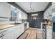 Bright and airy kitchen with stainless steel appliances, white cabinets, and a big kitchen sink window at 2072 S Rembrandt Cv, Martinsville, IN 46151