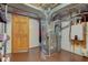 Unfinished basement featuring utilities including furnace and hot water heater near the access door at 222 Wellington Pkwy, Noblesville, IN 46060