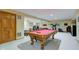 A finished basement with a classic pool table, providing an entertainment space and ample room for recreation at 222 Wellington Pkwy, Noblesville, IN 46060
