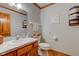 Cozy bathroom with wood cabinets, neutral countertops, and a large mirror at 222 Wellington Pkwy, Noblesville, IN 46060