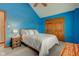 Cozy bedroom featuring a neutral color palette, vaulted ceiling, and double door closet at 222 Wellington Pkwy, Noblesville, IN 46060