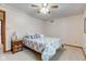 Inviting bedroom with soft neutral palette, patterned wallpaper, and ceiling fan for added comfort at 222 Wellington Pkwy, Noblesville, IN 46060