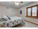 Charming bedroom featuring patterned wallpaper, neutral walls, and a cozy window nook at 222 Wellington Pkwy, Noblesville, IN 46060