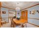 Formal dining room showcasing hardwood trim, light blue walls, and wooden dining set at 222 Wellington Pkwy, Noblesville, IN 46060