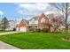 Beautiful two-story home with a well-manicured lawn, mature trees, and a three-car garage at 222 Wellington Pkwy, Noblesville, IN 46060