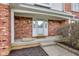 Inviting front porch with brick columns, elegant lighting, and decorative planters at 222 Wellington Pkwy, Noblesville, IN 46060