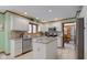 Well-lit kitchen with granite countertops, stainless steel appliances, and white cabinets at 222 Wellington Pkwy, Noblesville, IN 46060