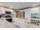 Spacious kitchen with stainless steel appliances, white cabinetry, and granite island at 222 Wellington Pkwy, Noblesville, IN 46060