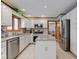 Bright kitchen featuring white cabinets, stainless steel appliances, and granite countertops at 222 Wellington Pkwy, Noblesville, IN 46060