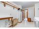 A bright laundry room featuring a folding table and doorway to another room at 222 Wellington Pkwy, Noblesville, IN 46060