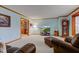 Comfortable living room with soft blue walls, plush carpet, and ample natural light at 222 Wellington Pkwy, Noblesville, IN 46060