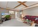 Spacious living room featuring a coffered ceiling and view to the kitchen at 222 Wellington Pkwy, Noblesville, IN 46060