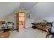 Large attic office space with doorway to the laundry room at 222 Wellington Pkwy, Noblesville, IN 46060