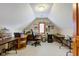 Attic office space featuring a vaulted ceiling, dormer window, and large workspace at 222 Wellington Pkwy, Noblesville, IN 46060