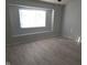Cozy bedroom with hardwood floors, a sunny window, and neutral paint at 2249 Grand Fir Dr, Greenwood, IN 46143