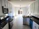 Modern kitchen with stainless steel appliances, granite countertops, and hardwood floors at 2249 Grand Fir Dr, Greenwood, IN 46143