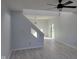 Modern living room with an open layout, light gray walls, hardwood floors, and modern lighting at 2249 Grand Fir Dr, Greenwood, IN 46143