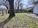This backyard features a lawn and a wooden fence at 2253 Chandler Ln, Columbus, IN 47203
