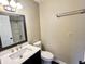 Clean bathroom featuring a modern vanity, mirror, toilet, and a shower-tub combination at 2253 Chandler Ln, Columbus, IN 47203