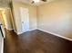 This bedroom features hardwood floors, ceiling fan, and a closet for optimal storage at 2253 Chandler Ln, Columbus, IN 47203