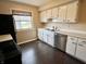 Well-lit kitchen featuring white cabinets, stainless steel appliances, and a modern design at 2253 Chandler Ln, Columbus, IN 47203