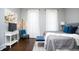 Comfortable bedroom featuring a queen-sized bed, natural light, and stylish décor at 234 S State Ave, Indianapolis, IN 46201