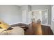 Spacious bedroom featuring hardwood floors, French doors, and plenty of natural light at 234 S State Ave, Indianapolis, IN 46201