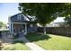 Charming two-story home with a well-maintained yard and mature tree at 234 S State Ave, Indianapolis, IN 46201