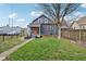 Charming two-story home featuring a well-maintained lawn and walkway leading to the front porch at 234 S State Ave, Indianapolis, IN 46201