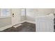 Functional laundry room features a modern washing machine, window, and tiled floor at 234 S State Ave, Indianapolis, IN 46201