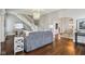 Stylish living room featuring hardwood floors, stairs, and views into the dining area at 234 S State Ave, Indianapolis, IN 46201