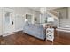 Open-concept living area with dark hardwood floors and stairs in the background at 234 S State Ave, Indianapolis, IN 46201