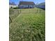 Spacious backyard with a black chain link fence perfect for gardening and entertaining at 2509 Bristlecone Dr, Indianapolis, IN 46217