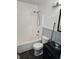 Standard bathroom featuring a shower-tub combo, toilet, and bowl sink at 2509 Bristlecone Dr, Indianapolis, IN 46217