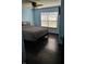 Bedroom with hardwood floors and window view at 2509 Bristlecone Dr, Indianapolis, IN 46217