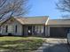 Charming single-story home featuring an attached garage and inviting front porch area perfect for enjoying the outdoors at 2509 Bristlecone Dr, Indianapolis, IN 46217