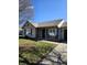 Inviting single-story home with a cozy front porch seating area and well-maintained lawn, adding to its curb appeal at 2509 Bristlecone Dr, Indianapolis, IN 46217