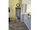 A kitchen with a wine rack with dining area and a view of the hallway at 2509 Bristlecone Dr, Indianapolis, IN 46217