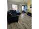 Comfortable living room with a large sectional sofa and tile flooring, ideal for relaxing and entertaining guests at 2509 Bristlecone Dr, Indianapolis, IN 46217