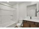 Well-lit bathroom features a shower-tub combo, a wood vanity, and a large mirror at 260 Onset Way, Westfield, IN 46074