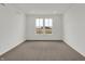 Bright bedroom featuring carpet floors, large windows with natural light, and neutral paint at 260 Onset Way, Westfield, IN 46074