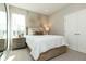Cozy bedroom featuring a wooden bed frame, stylish wall decor, and a nightstand with lamps at 260 Onset Way, Westfield, IN 46074