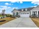 Beautiful single-Gathering home with gray siding, stone accents, two-car garage, and a concrete driveway at 260 Onset Way, Westfield, IN 46074