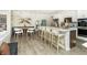 Open concept kitchen with stainless appliances, a large island with seating, and an adjacent dining area at 260 Onset Way, Westfield, IN 46074