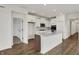 Contemporary kitchen showcasing a center island with contrasting wood accents, stainless appliances, and ample storage at 260 Onset Way, Westfield, IN 46074