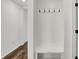Mudroom with storage bench, coat hooks, and hardwood floors at 260 Onset Way, Westfield, IN 46074