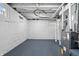 Spacious basement featuring painted floors and white walls, ready for customization at 2920 E 11Th St, Indianapolis, IN 46201