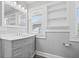 Elegant bathroom featuring a vanity, framed mirror and built-in shelving at 2920 E 11Th St, Indianapolis, IN 46201
