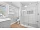 Modern bathroom with a glass-enclosed shower, white tile, and a stylish vanity at 2920 E 11Th St, Indianapolis, IN 46201